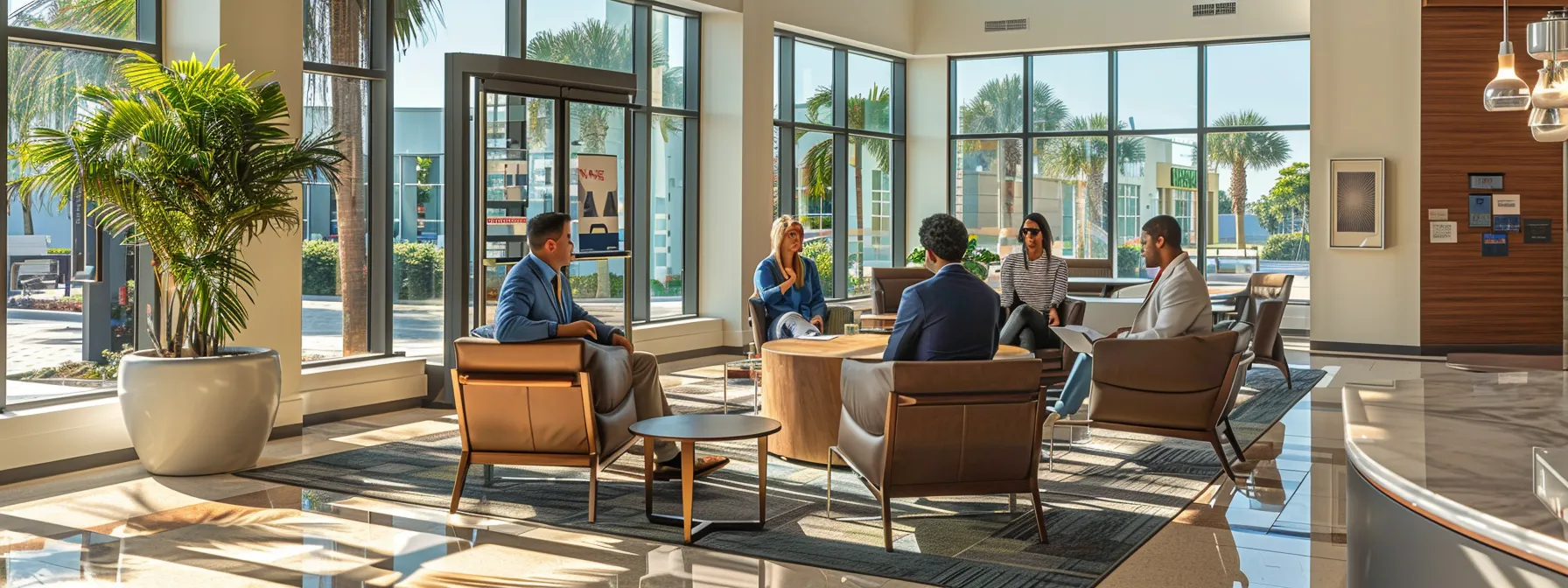 a professional office setting bathed in soft natural light, featuring a diverse group of business people engaged in a focused discussion around a table, symbolizing collaboration and understanding of florida's workers’ compensation laws.